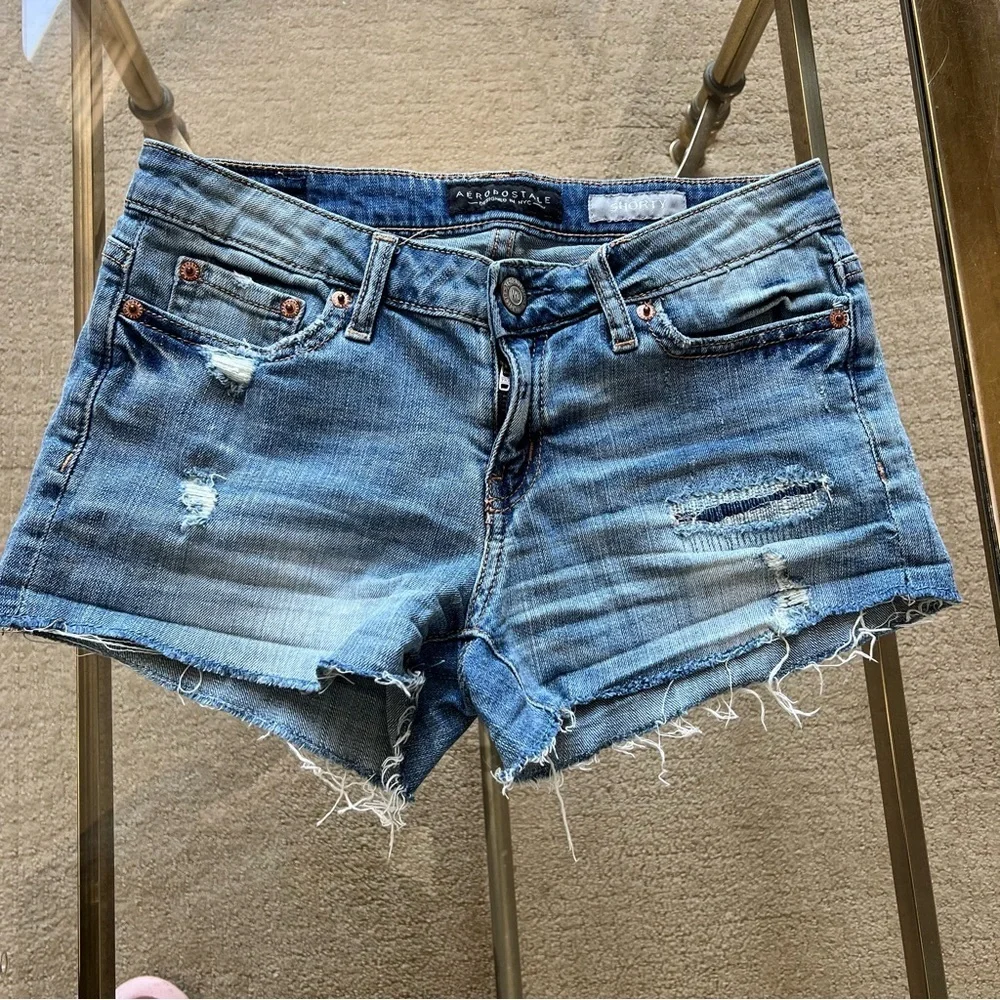 Distressed denim shorts.